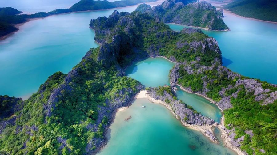 New Vietnam travel spots 2025 showcase Bai Tu Long’s serene emerald waters