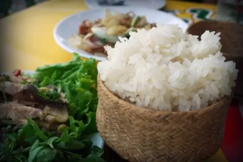 Traditional Khao Niaw (sticky rice) eaten with Laap.