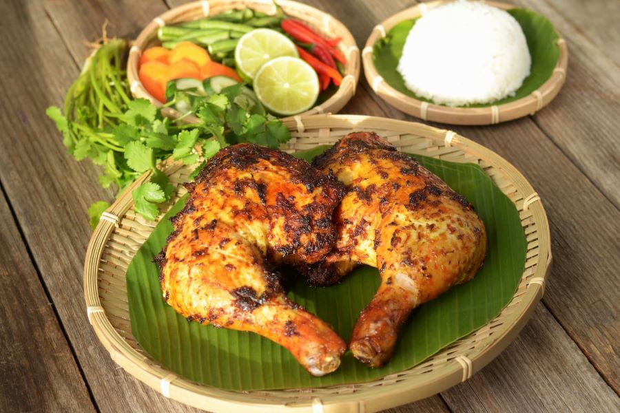 Laos food favorite, Ping Gai serves juicy chicken with bold herbal flavors